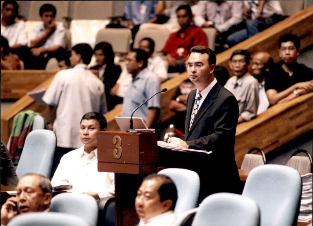 Alan Peter Cayetano addresses the assembly, presenting a formal speech, engaging in legislative debate, and advocating for policy from the podium.