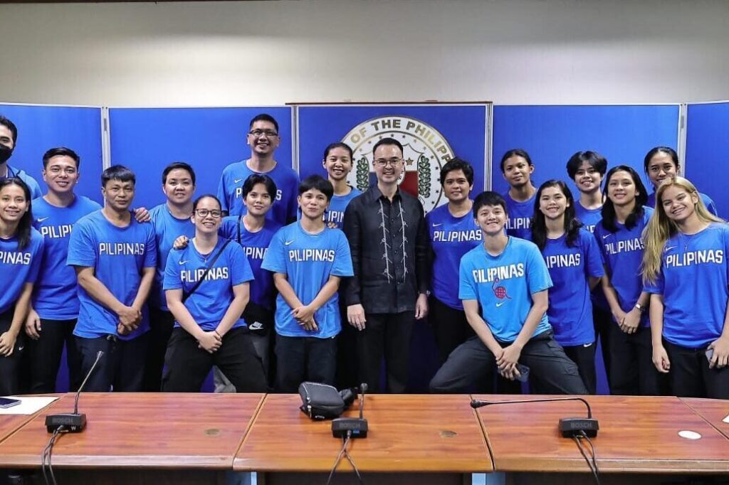 Alan Peter Cayetano stands with the Philippine team, showing support, fostering national pride, and promoting sports in the Philippines.